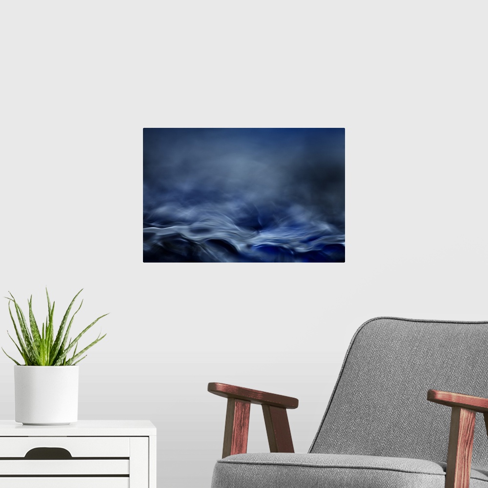 A modern room featuring Abstract digital art resembling  a moving water landscape.