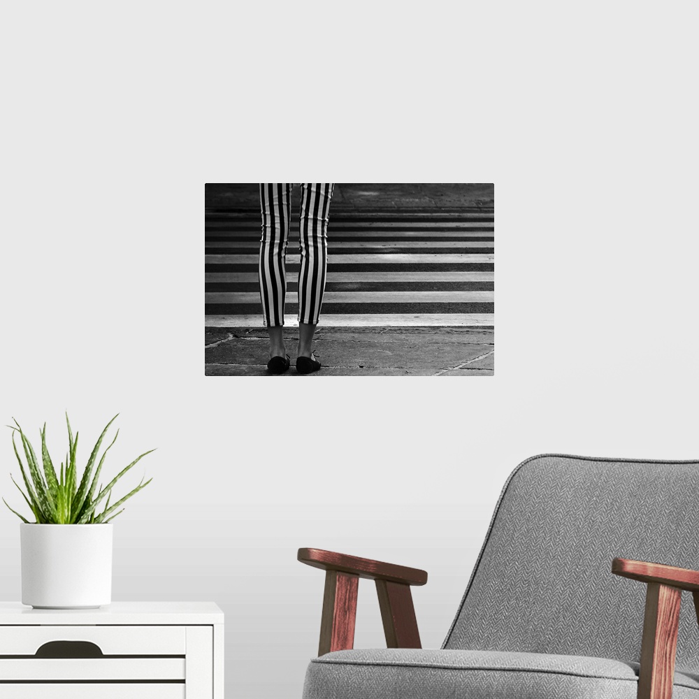 A modern room featuring Black and white striped leggings perpendicular to the striped zebra crossing in the street.