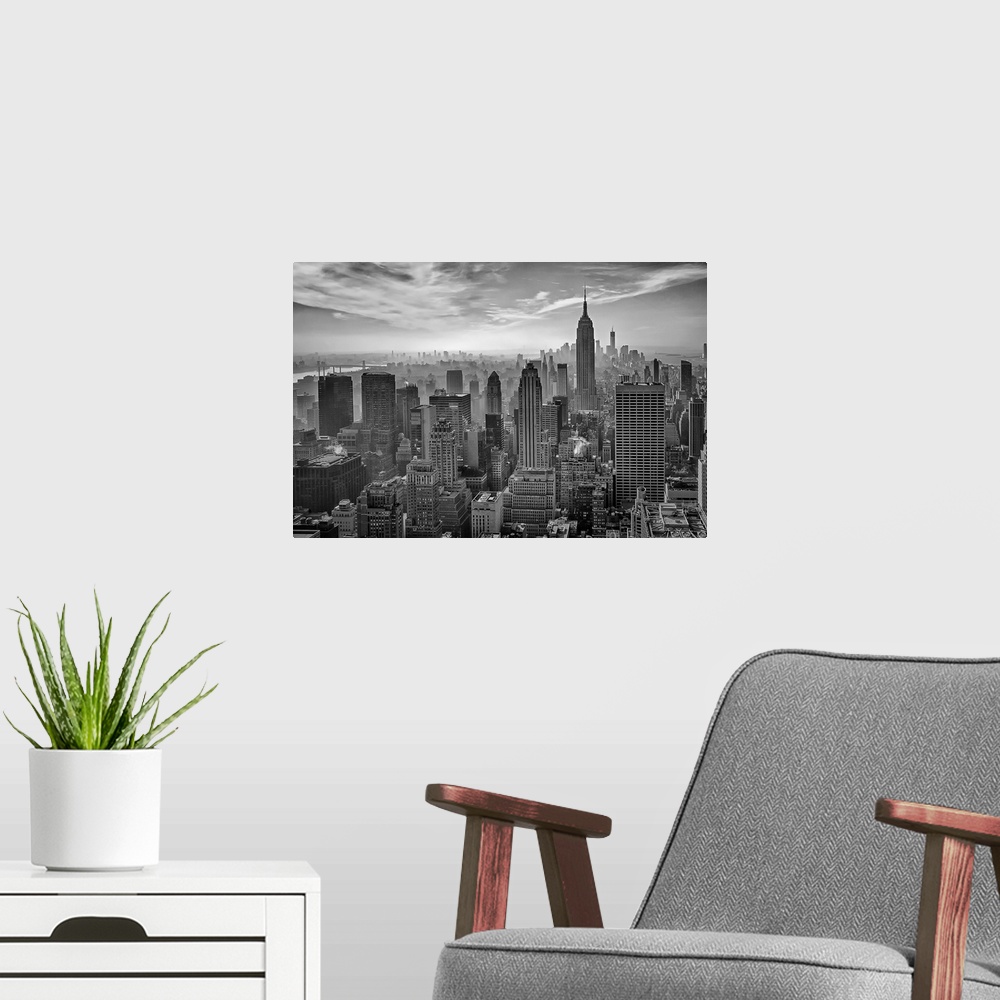 A modern room featuring A black and white photograph of the Empire state building standing tall in New York city.