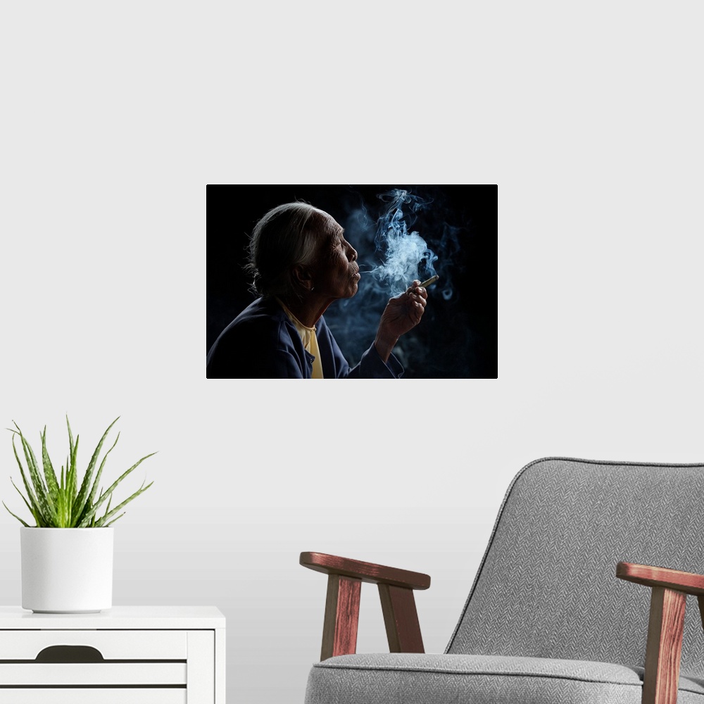 A modern room featuring A profile portrait of an old woman with smoke pouring from her mouth.