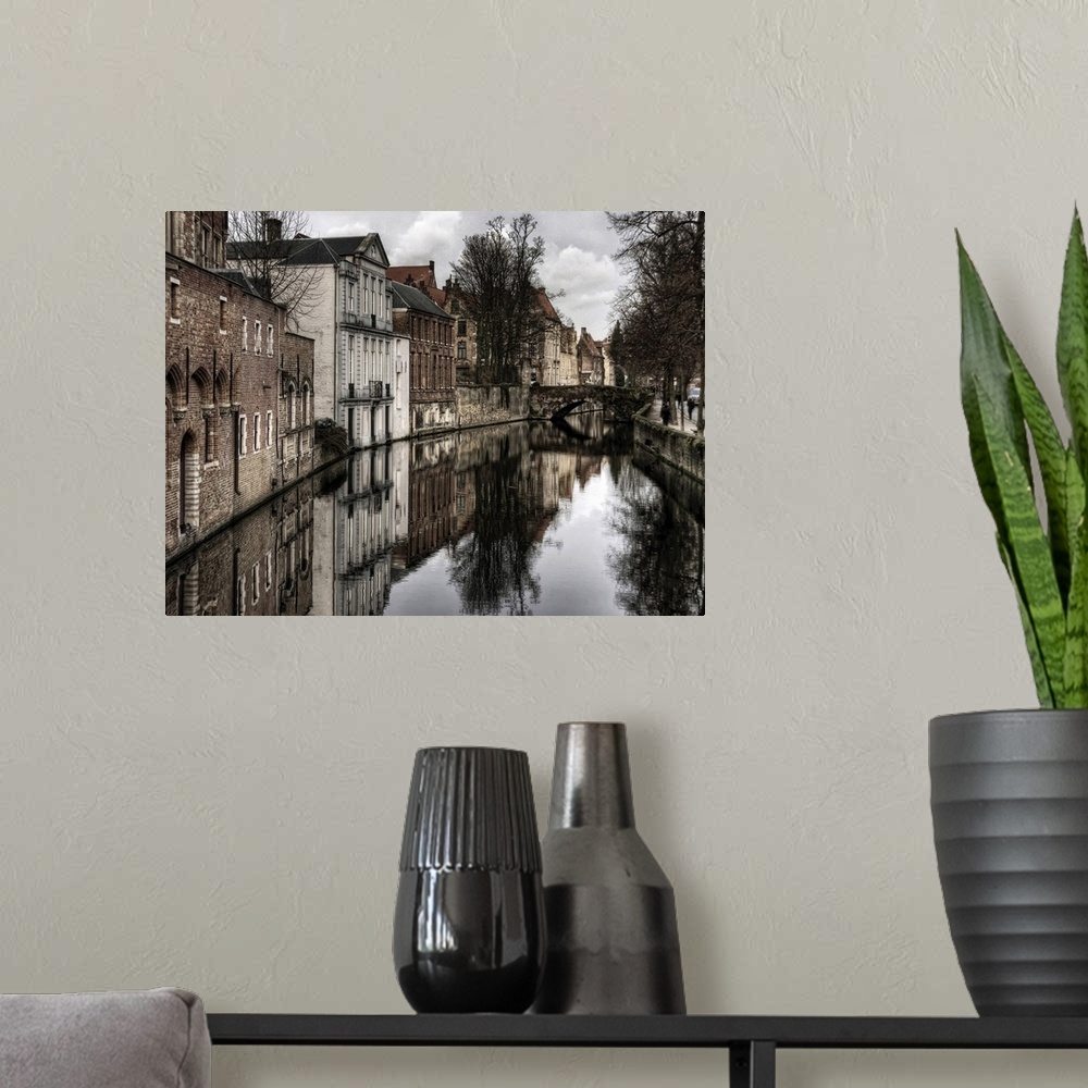 A modern room featuring Canal in the city of Bruges, Belgium, on a cloudy day in the winter.