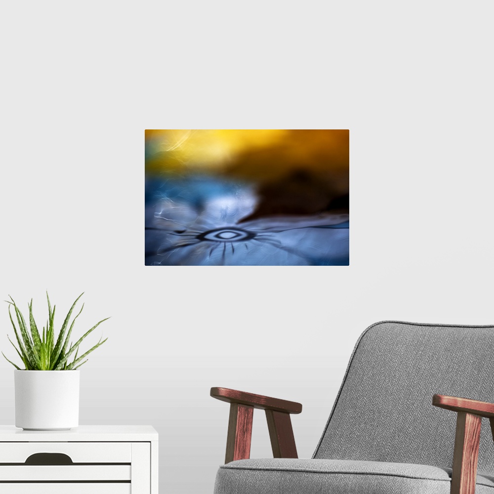 A modern room featuring Abstract digital art resembling a flower in water.