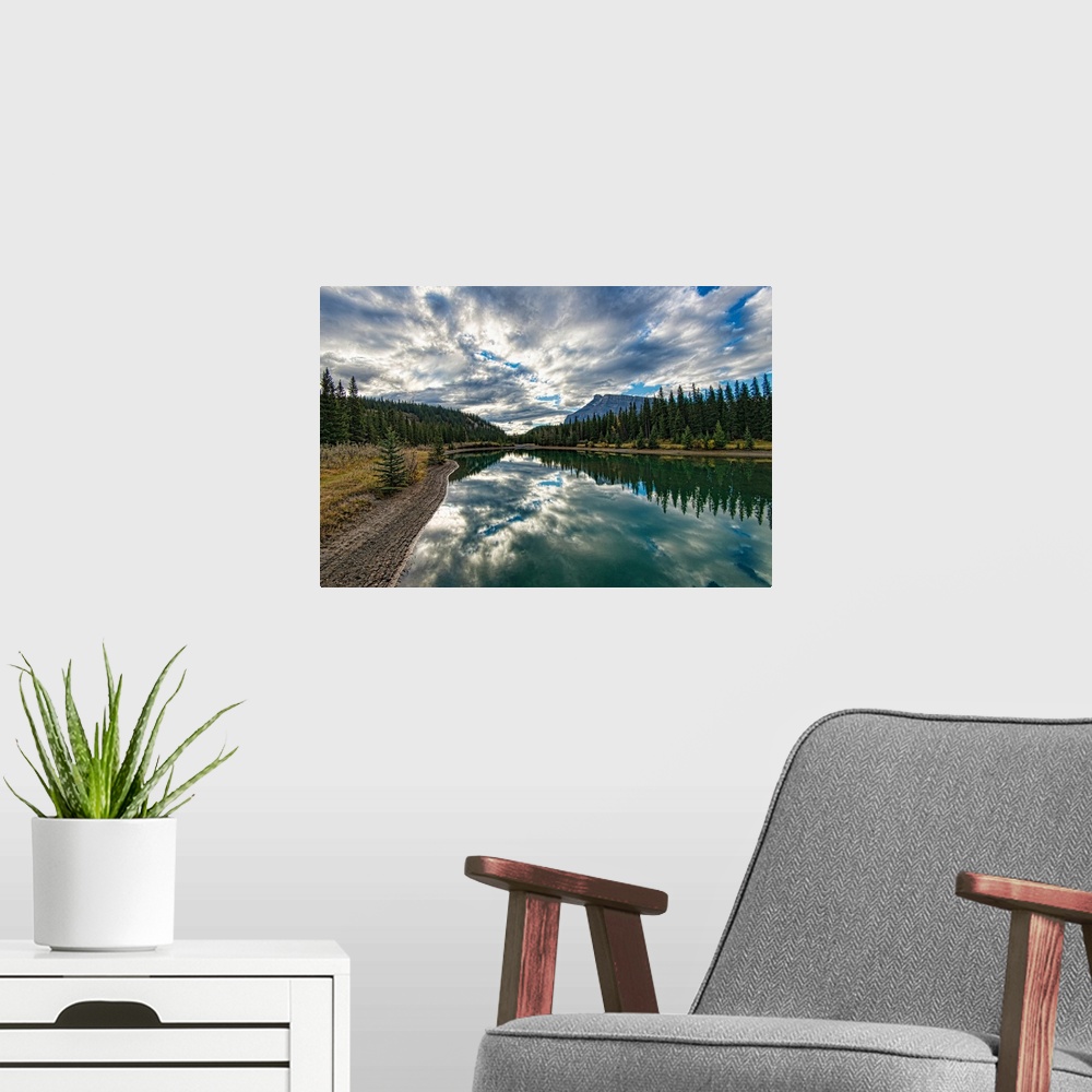 A modern room featuring Reflective and picturesque Cascade Ponds just outside of Banff, in Banff National Park, Canadian ...