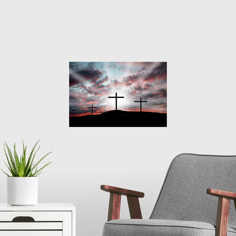 A modern room featuring Three crosses on a hillside. Dramatic light announcing the resurrection.