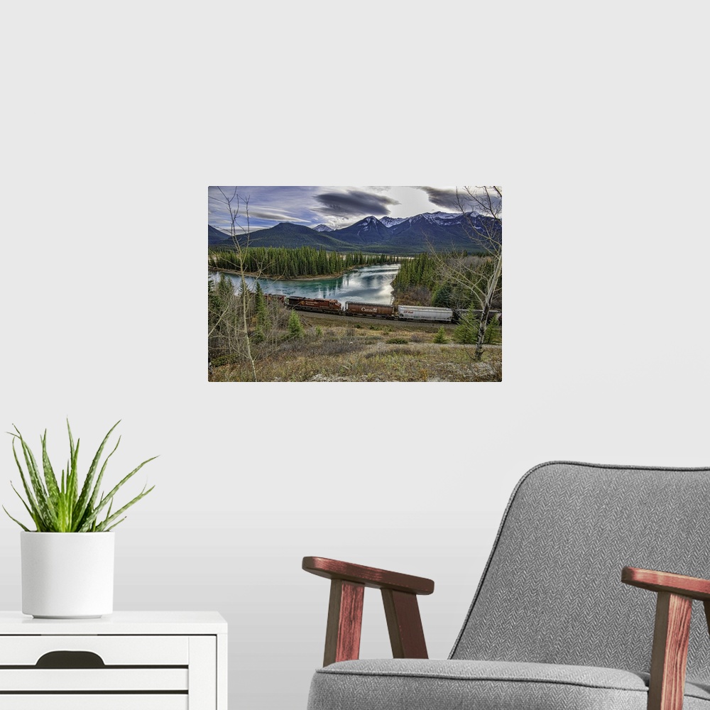A modern room featuring Train along river in Banff, Canada