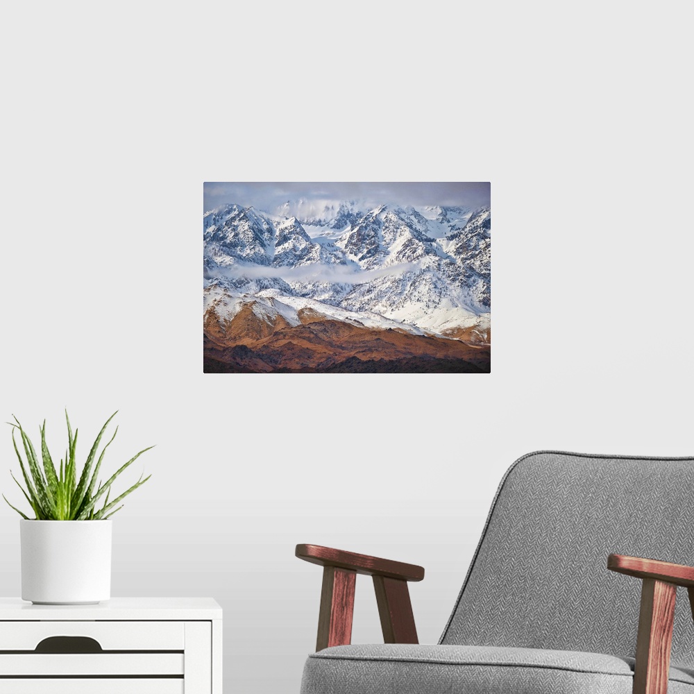 A modern room featuring Wintry mountains with snow-capped peaks along California's 395 in the Eastern Sierras.