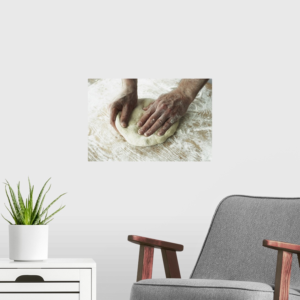 A modern room featuring Close-Up Of Hands Kneading Dough