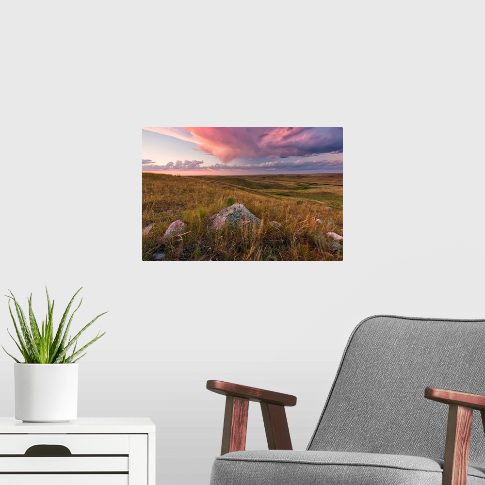 A modern room featuring Clouds Lit At Sunset With Some Glacial Erratics Lying In Grasslands National Park;Saskatchewan Ca...
