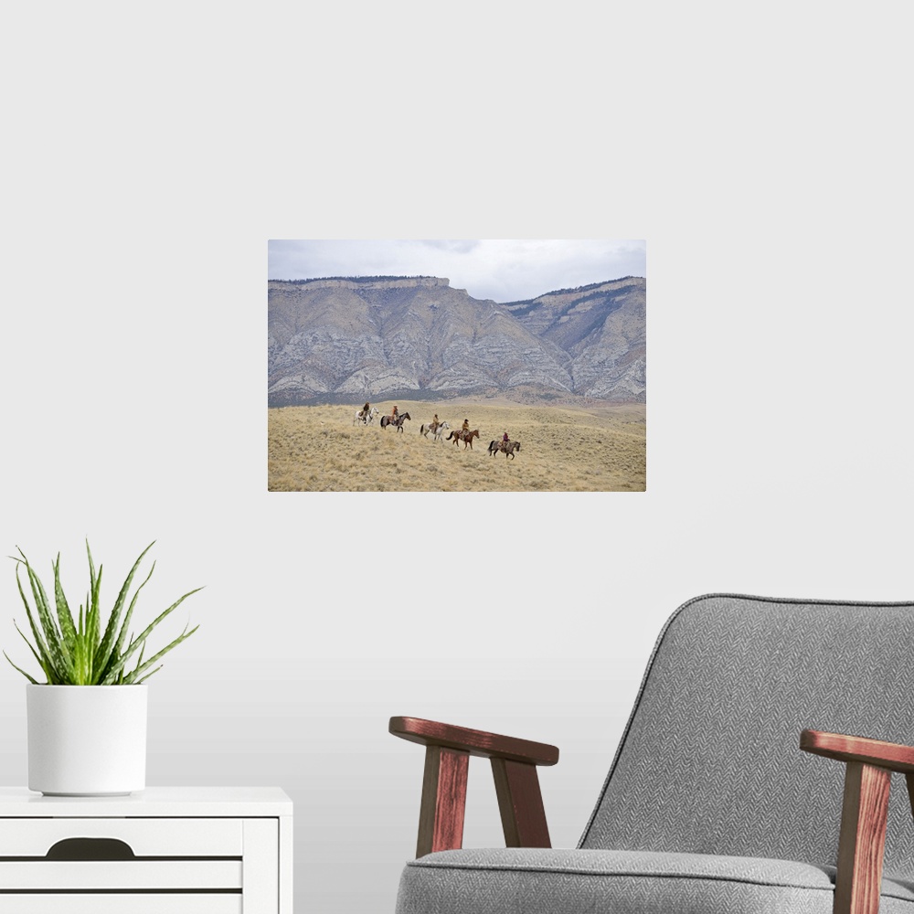 A modern room featuring Cowboys and Cowgirls riding horse in wilderness, Rocky Mountain, Wyoming