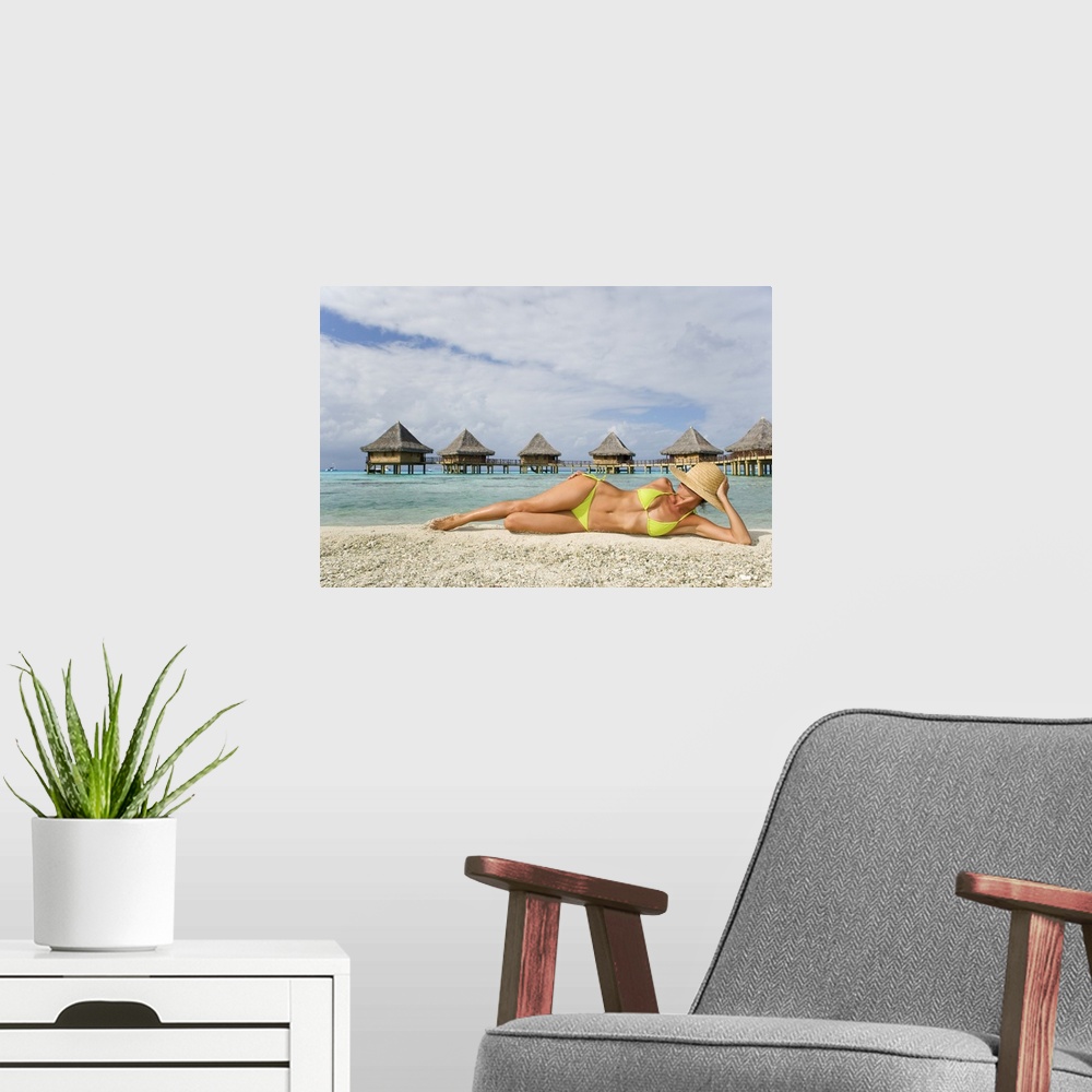 A modern room featuring French Polynesia, Tuamotu Islands, Rangiroa Atoll, Woman Lounging On Beach
