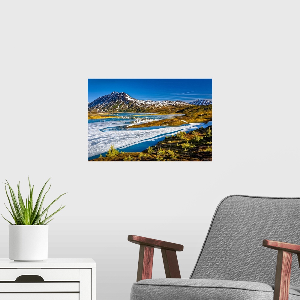 A modern room featuring Half frozen Lost Lake in the morning, Chugach Mountains in the background. Chugach National Fores...