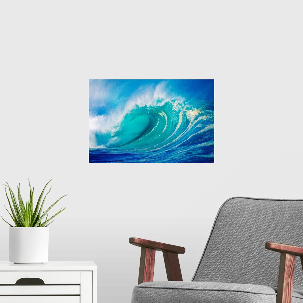 A modern room featuring Big photograph showcases a giant wave after it has curled and now prepares to break against the s...