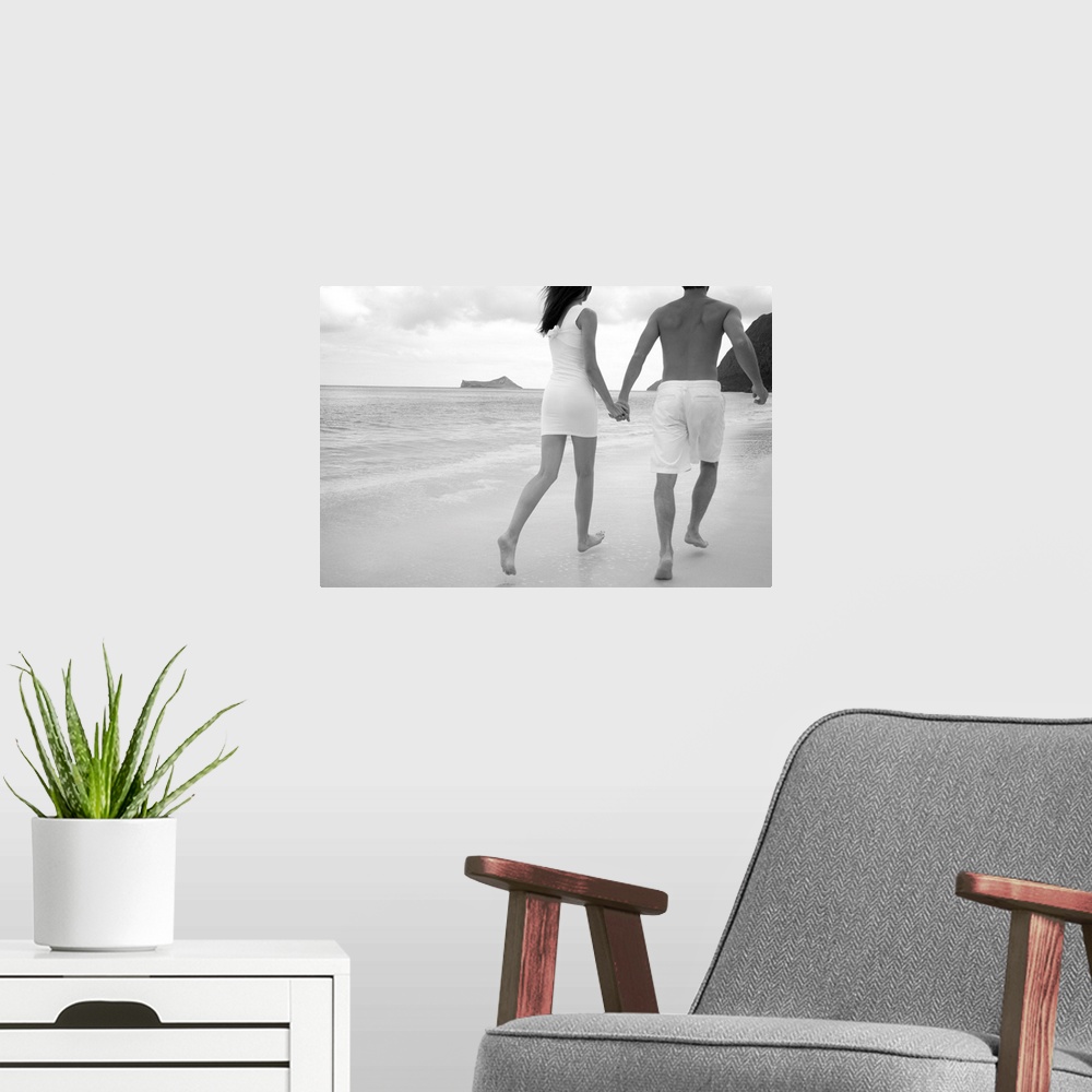 A modern room featuring Hawaii, Oahu, Waimanalo, Young Couple Holding Hands Running Together Along The Beach