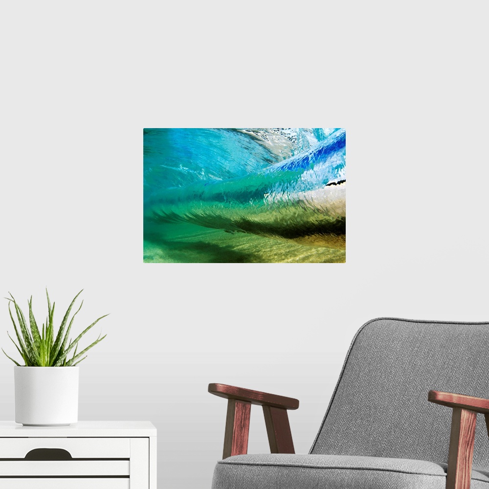 A modern room featuring Canvas photo art of a wave about to crash seen from underneath the water.