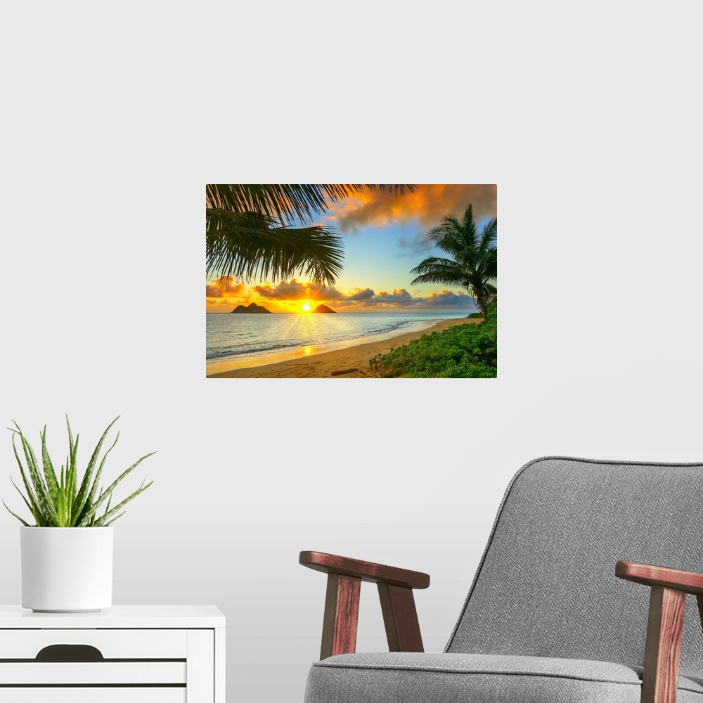A modern room featuring Sunrise viewed from Lanikai Beach with a view of the Mokulua Islands off the coast; Oahu, Hawaii,...
