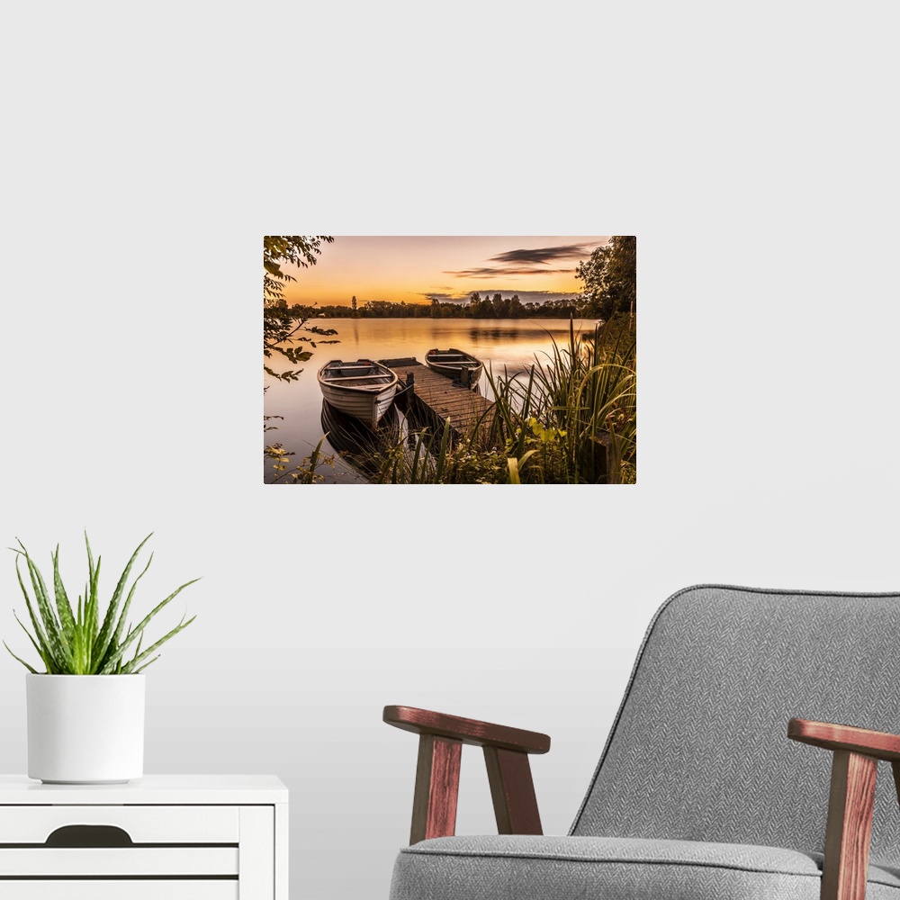 A modern room featuring Late summer sunrise on one of the lakes at Cotswold Water Park.