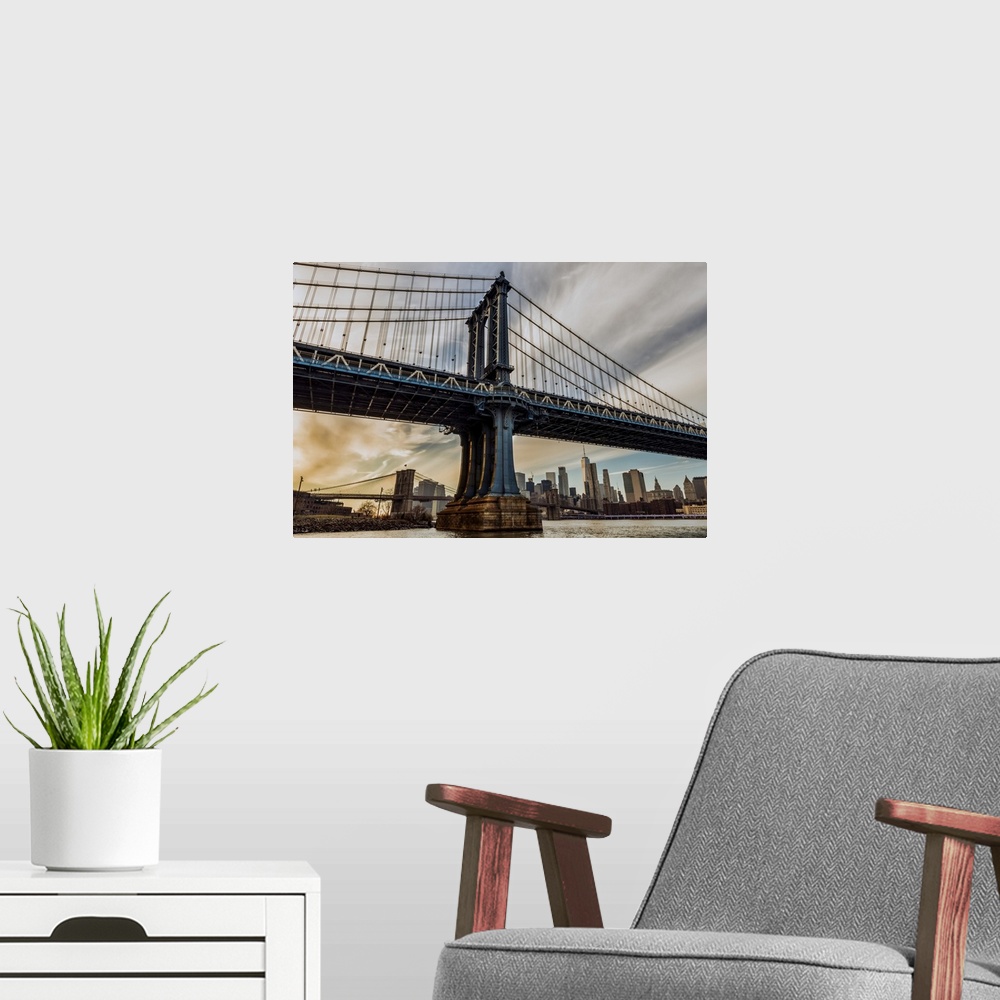 A modern room featuring Manhattan Bridge at sunset, Brooklyn Bridge Park; Brooklyn, New York, United States of America