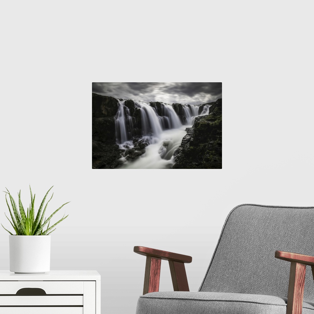 A modern room featuring Moody image of waterfalls in the central area of Iceland in a long exposure, Iceland.