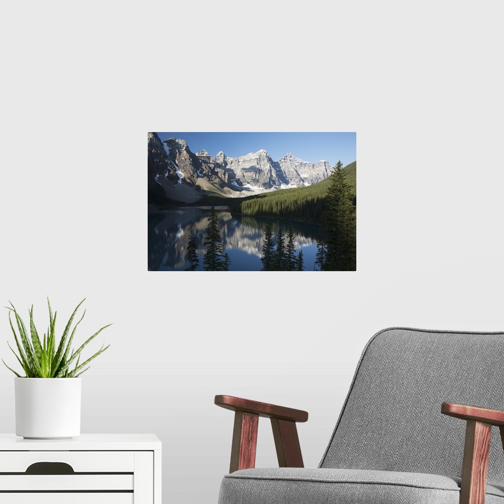 A modern room featuring Mountain Range And Lake Reflection With Blue Sky; Alberta, Canada
