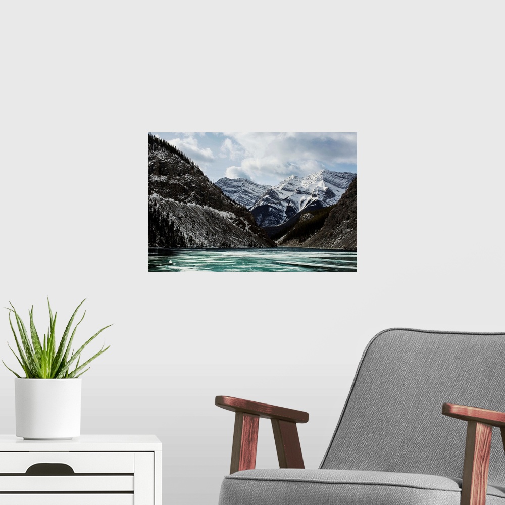 A modern room featuring Mountains and frozen lake in winter, Bow Valley Wildland. Alberta, Canada.