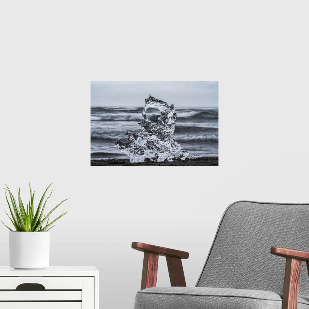 A modern room featuring Piece of ice on diamond beach, near Jokusarlon, with the ocean behind it along the south coast of...