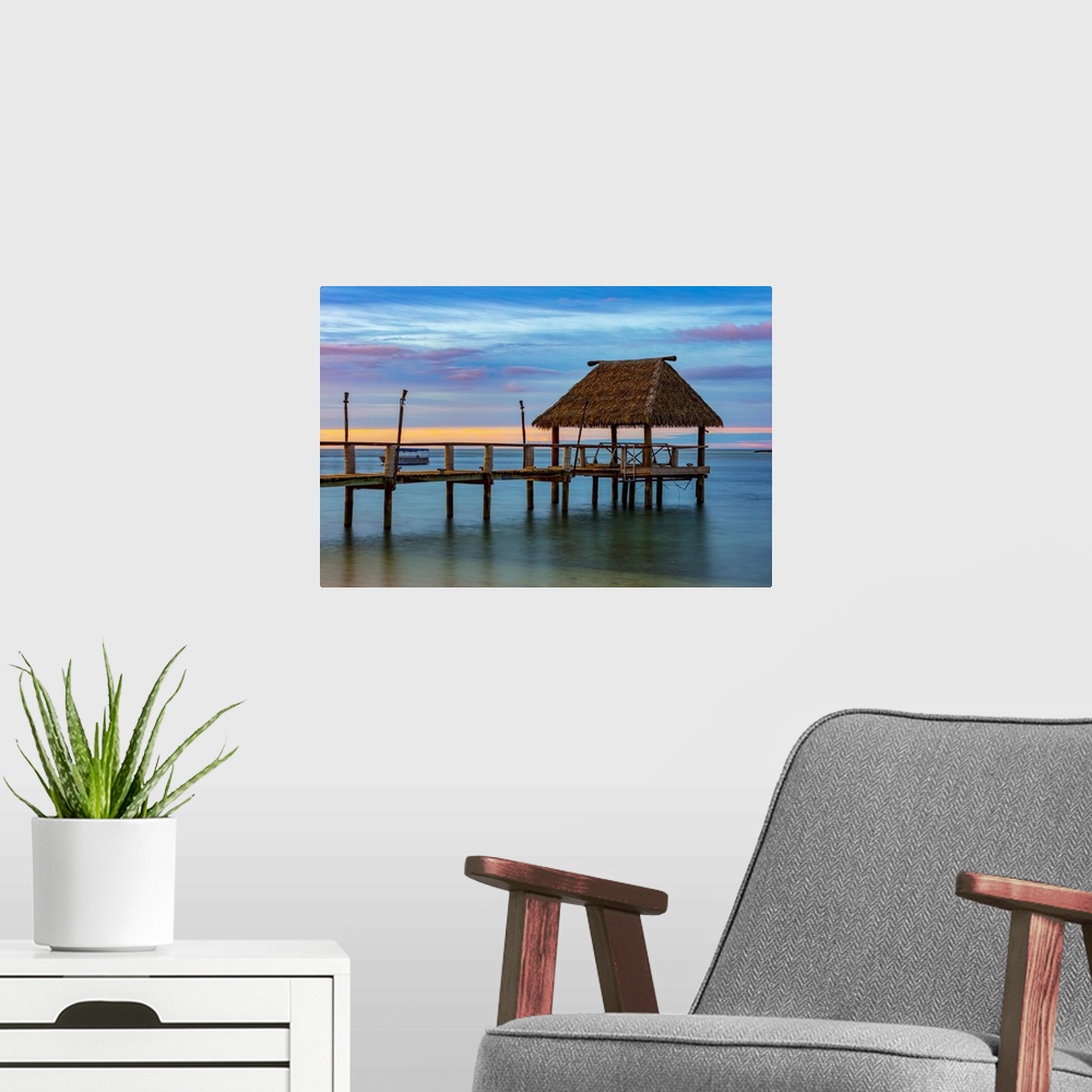 A modern room featuring Pier off Malolo Island in the South Pacific at sunrise; Malolo Island, Fiji