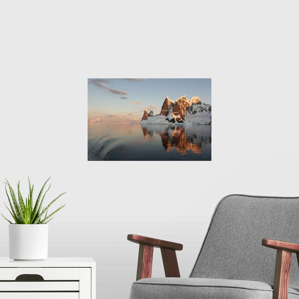 A modern room featuring Reflections of cliffs and mountains in the Lemaire Channel at sunset, Antarctica