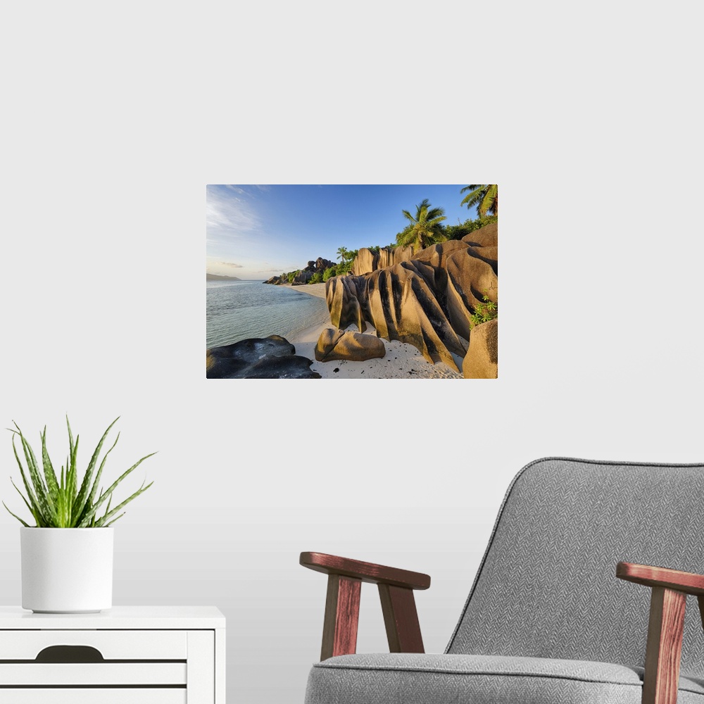 A modern room featuring Rock Formations and Palm Trees near Sunset, Anse Source doArgent, La Digue, Seychelles