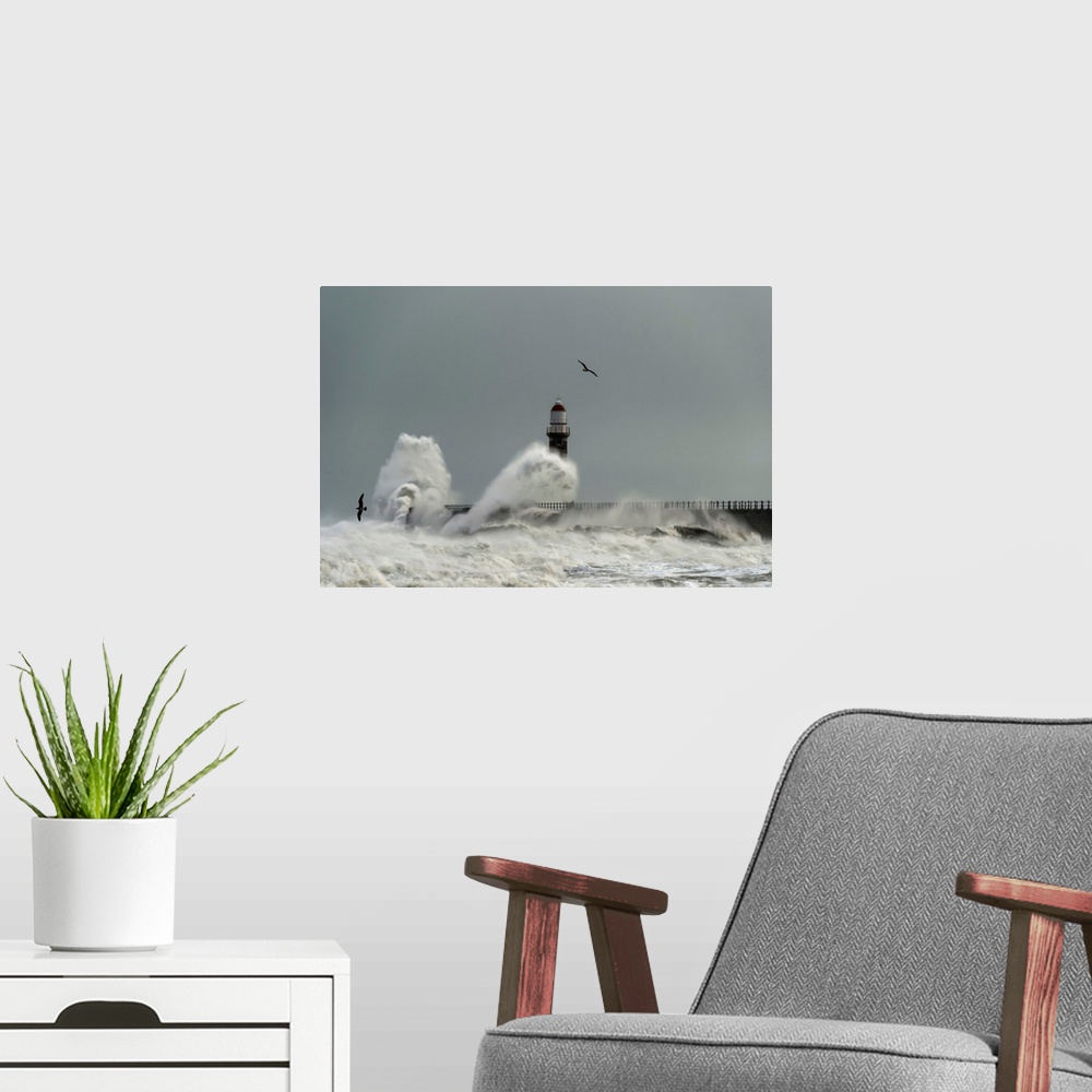 A modern room featuring Roker lighthouse and waves from the river ware crashing onto the pier. Sunderland, Tyne and Wear,...