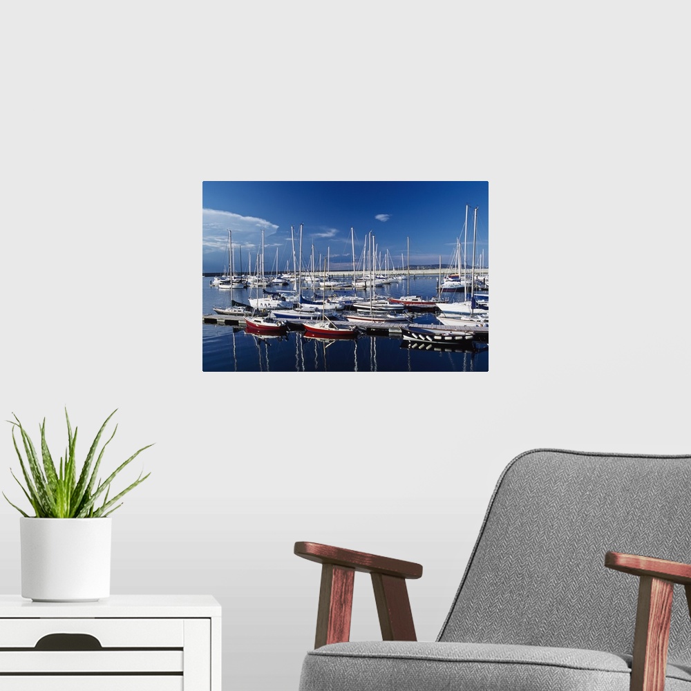 A modern room featuring Sailboats Moored In Harbor Marina