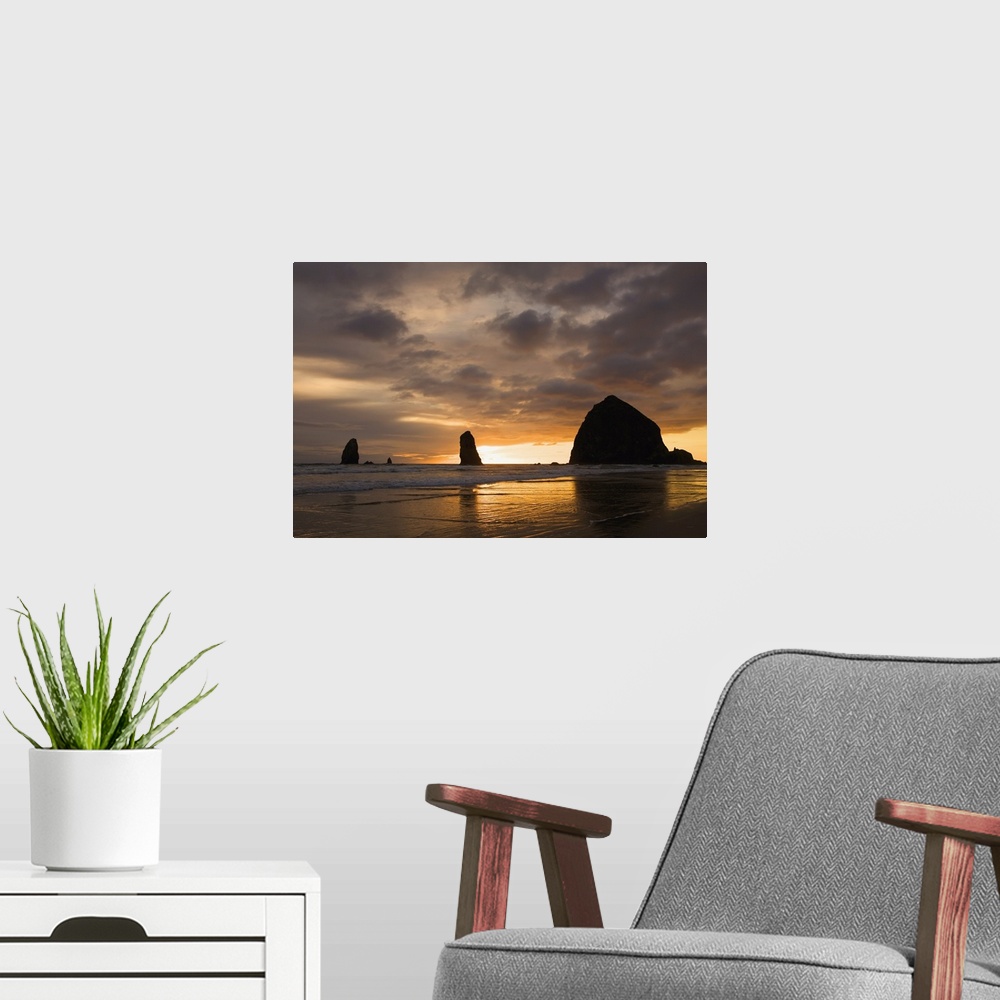 A modern room featuring Silhouette Of Rock Formations At Sunset; Cannon Beach, Oregon, USA