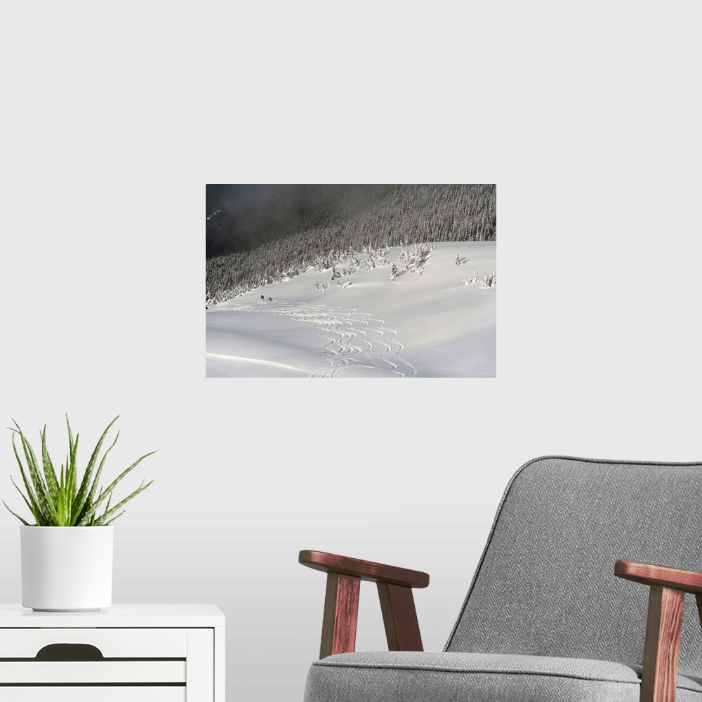 A modern room featuring Skiers At The Base Of A Mountain; Whistler, British Columbia, Canada