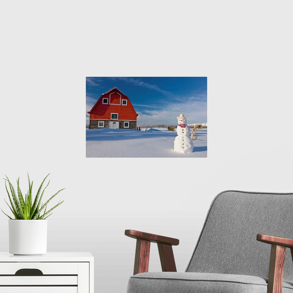 A modern room featuring Snowman dressed up as a cowboy standing in front of a vintage red barn