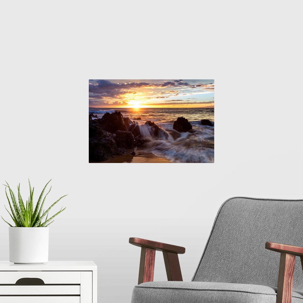A modern room featuring Soft water over lava rocks during sunset; Makena, Maui, Hawaii, United States of America.