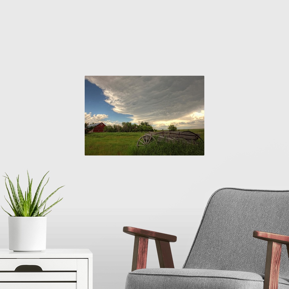 A modern room featuring Storm Clouds Gather Over An Abandoned Farm, Saskatchewan, Canada