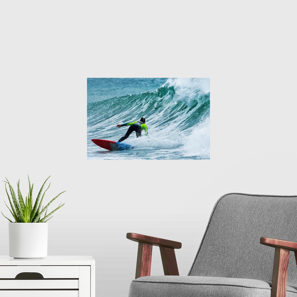 A modern room featuring Surfer catching a wave. Tarifa, Cadiz, Andalusia, Spain.