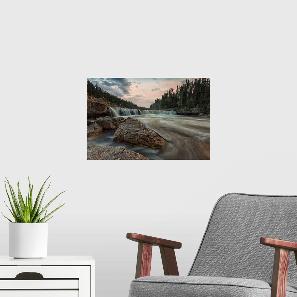 A modern room featuring The Trout River Flows Over Sambaa Deh Falls In Sambaa Deh Territorial Park, Northwest Territories...