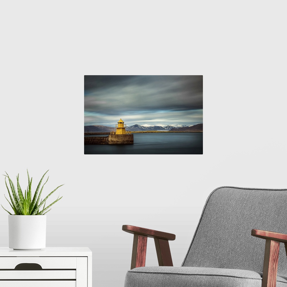 A modern room featuring The yellow lighthouse Nordurgardi at Reykjavik harbour.