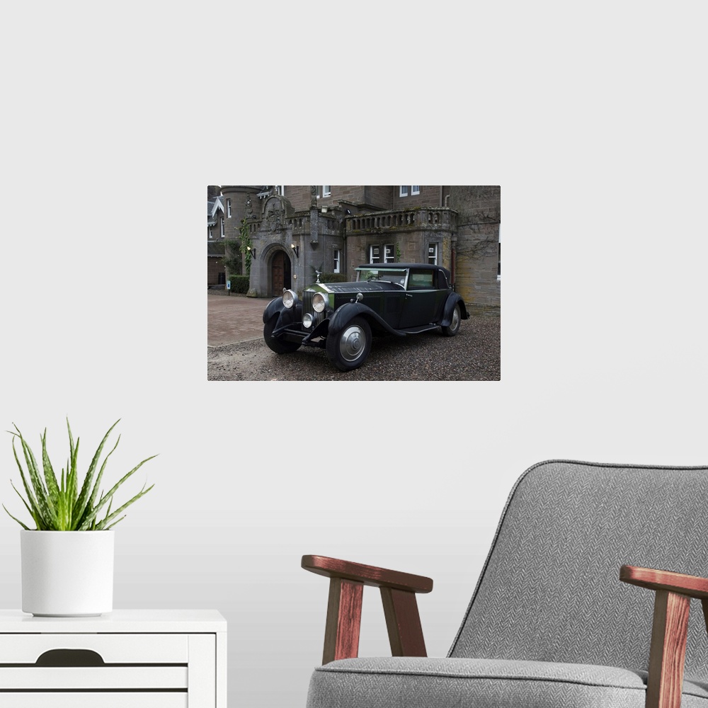 A modern room featuring Vintage black car parked outside a large home, Perthshire, Scotland.