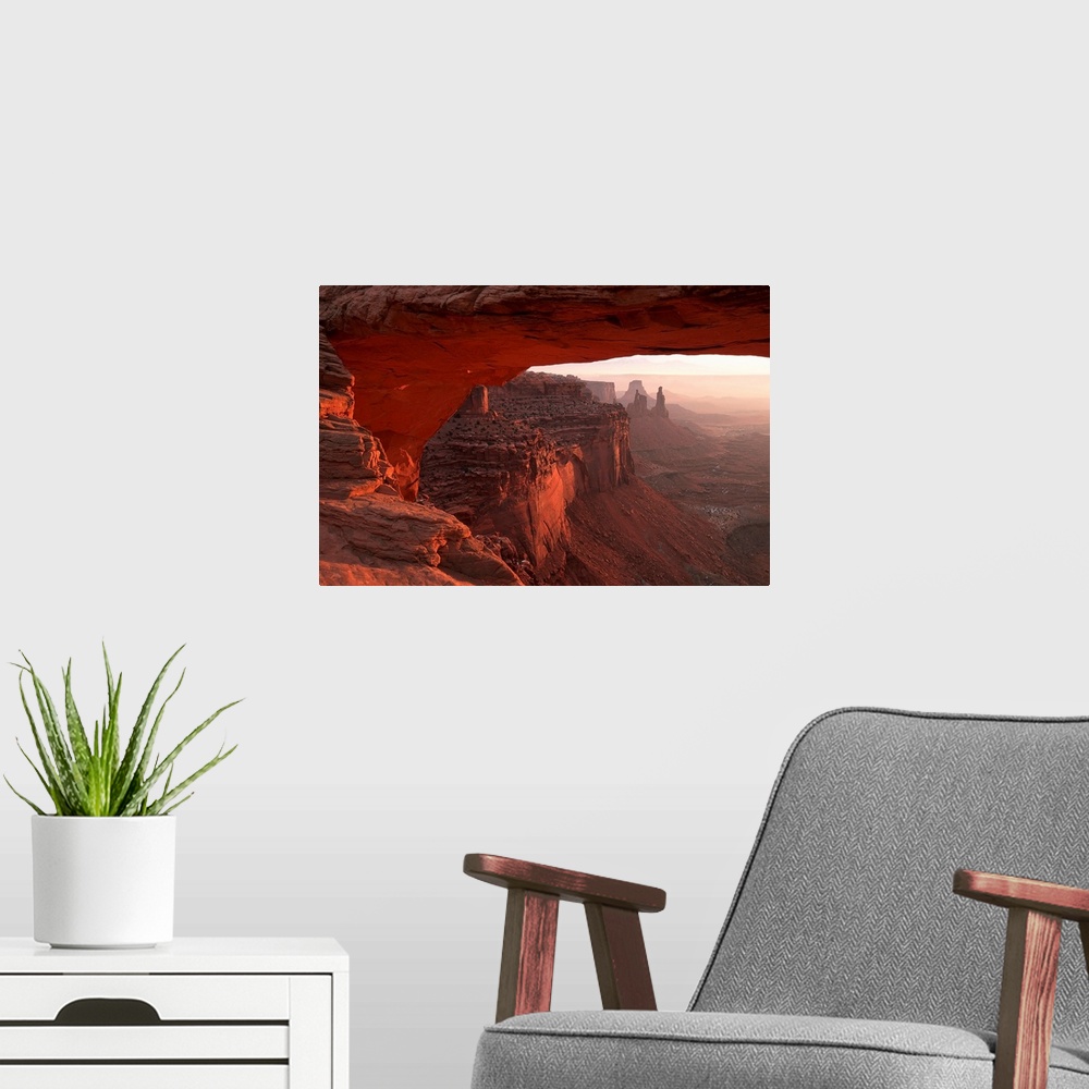 A modern room featuring Washer Woman Arch Viewed Through Mesa Arch In Canyonlands National Park; Utah