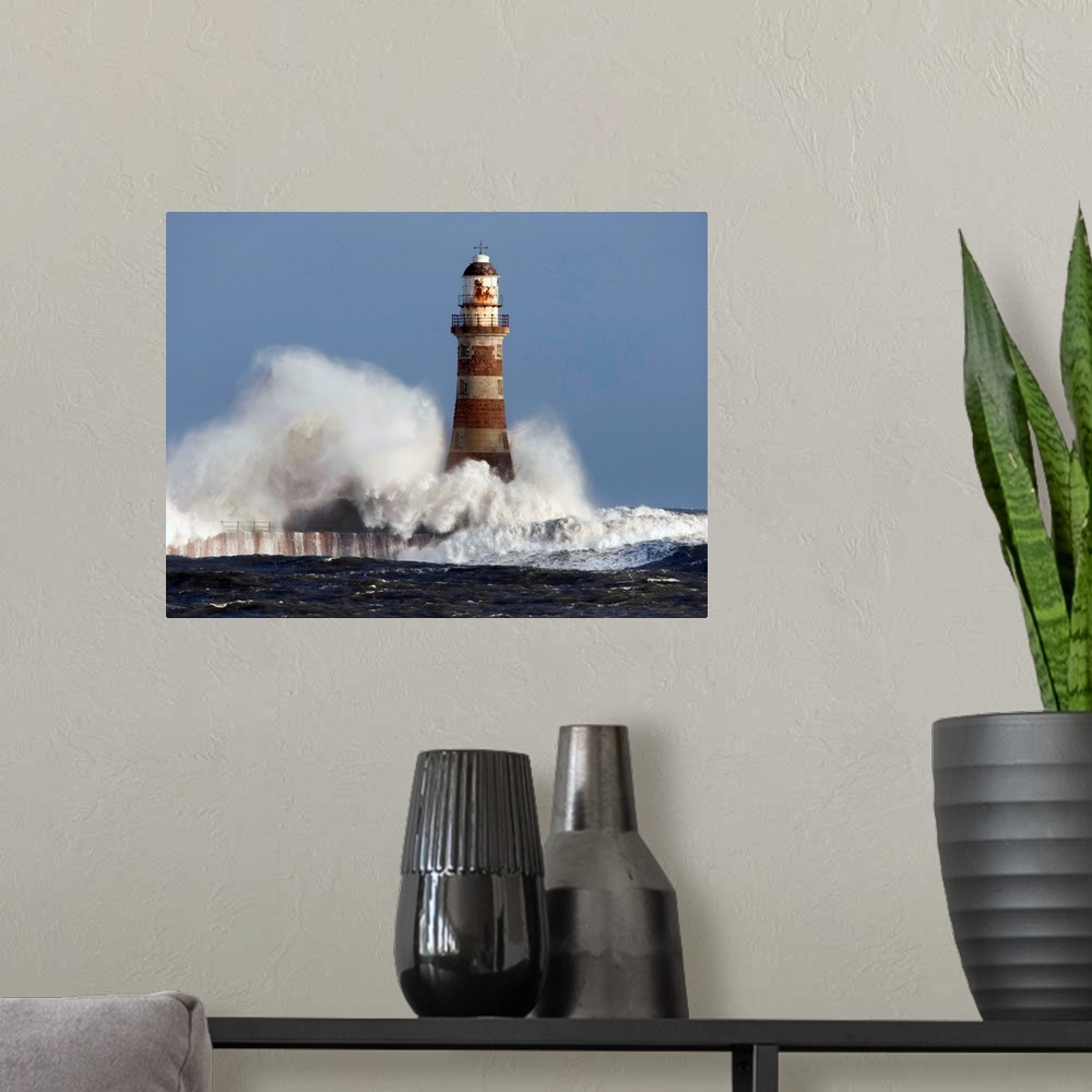 A modern room featuring Waves Crashing Against A Lighthouse; Sunderland, Tyne And Wear, England