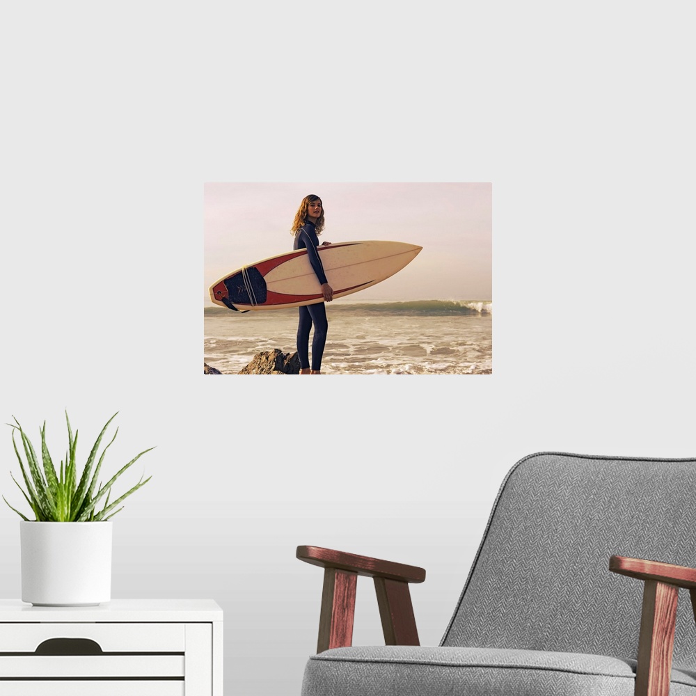 A modern room featuring Young Woman With Her Surfboard At The Beach, Tarifa, Cadiz, Andalusia, Spain