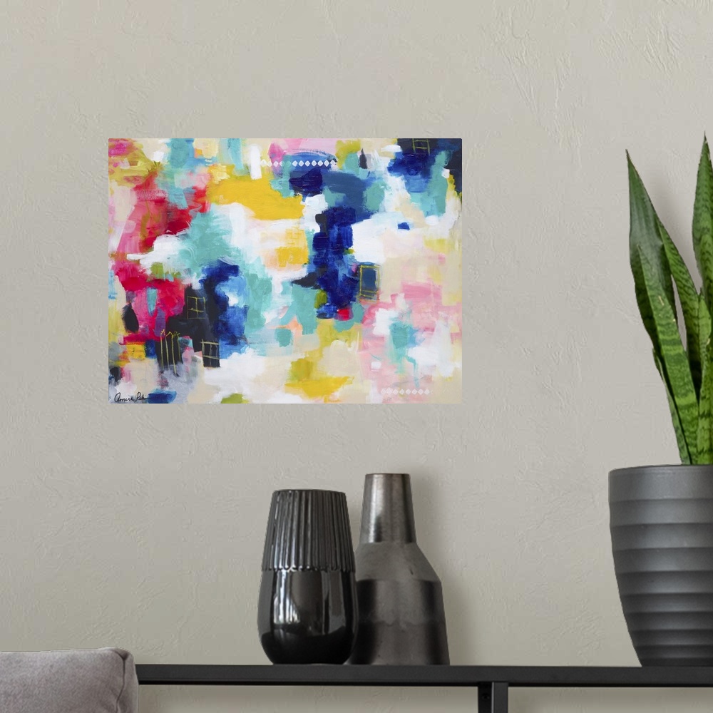 A modern room featuring Brightly colored abstract mixed media artwork.