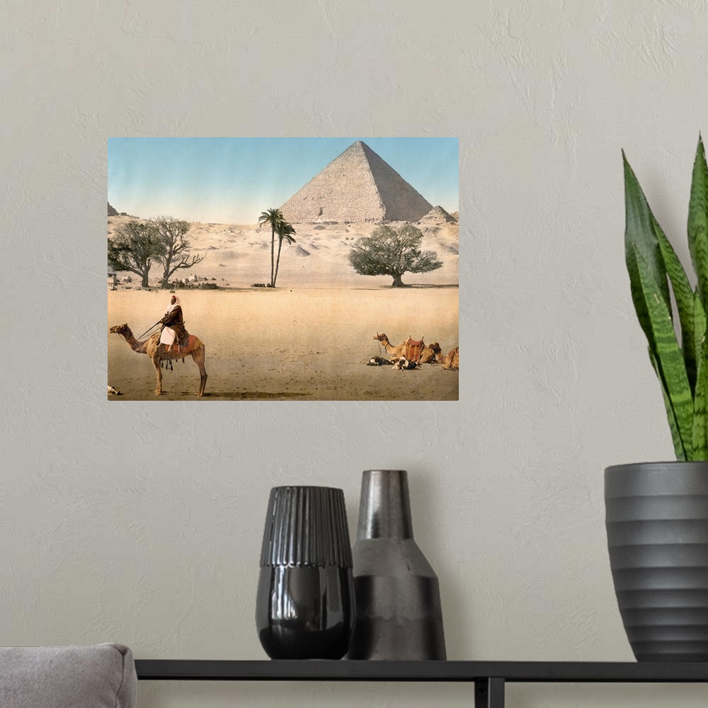 A modern room featuring Hand colored photograph of resting Bedouins and the grand pyramid, Cairo, Egypt.