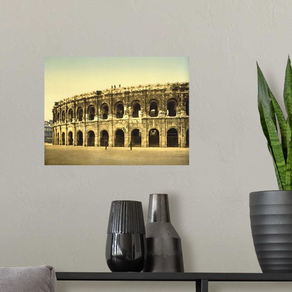 A modern room featuring Hand colored photograph of the arena, Nimes, France.