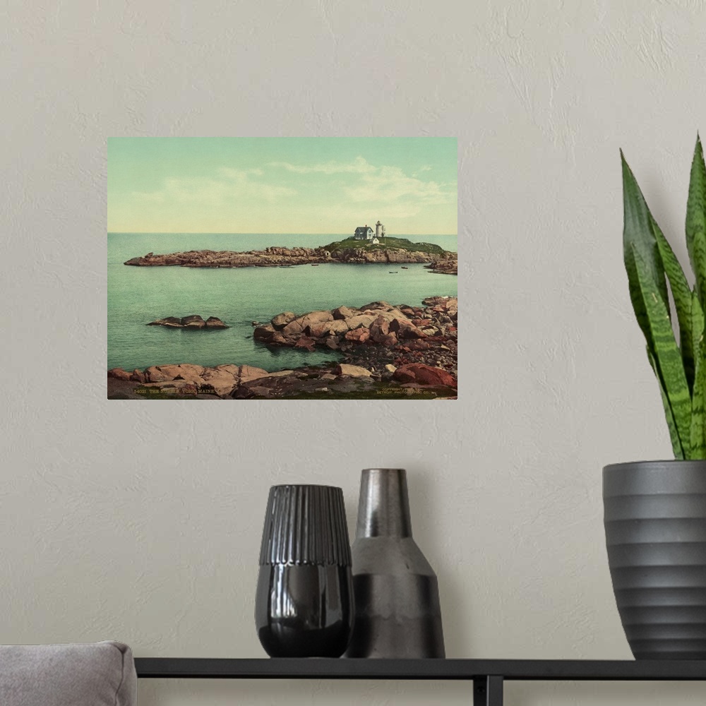 A modern room featuring Hand colored photograph of the nubble, York, Maine.