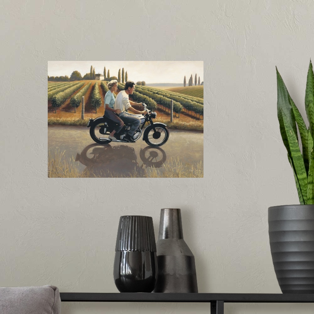 A modern room featuring Contemporary painting of a man and woman on a motorcycle riding through Tuscany.