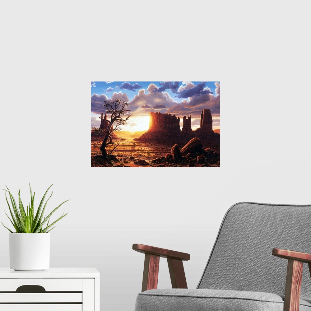 A modern room featuring The sun setting behind the rock formations of Monument Valley.