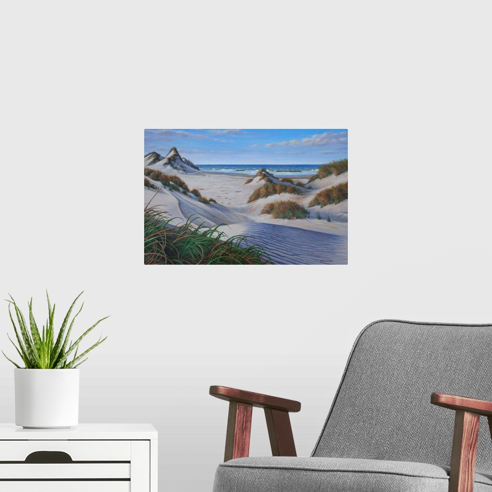 A modern room featuring Contemporary artwork of several grassy sand dunes on the beach.
