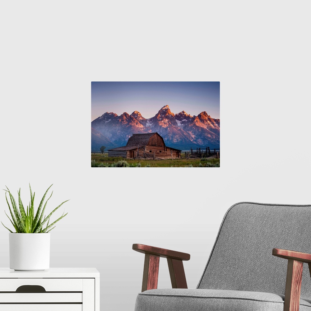 A modern room featuring Barn in front of the mountains, color photography